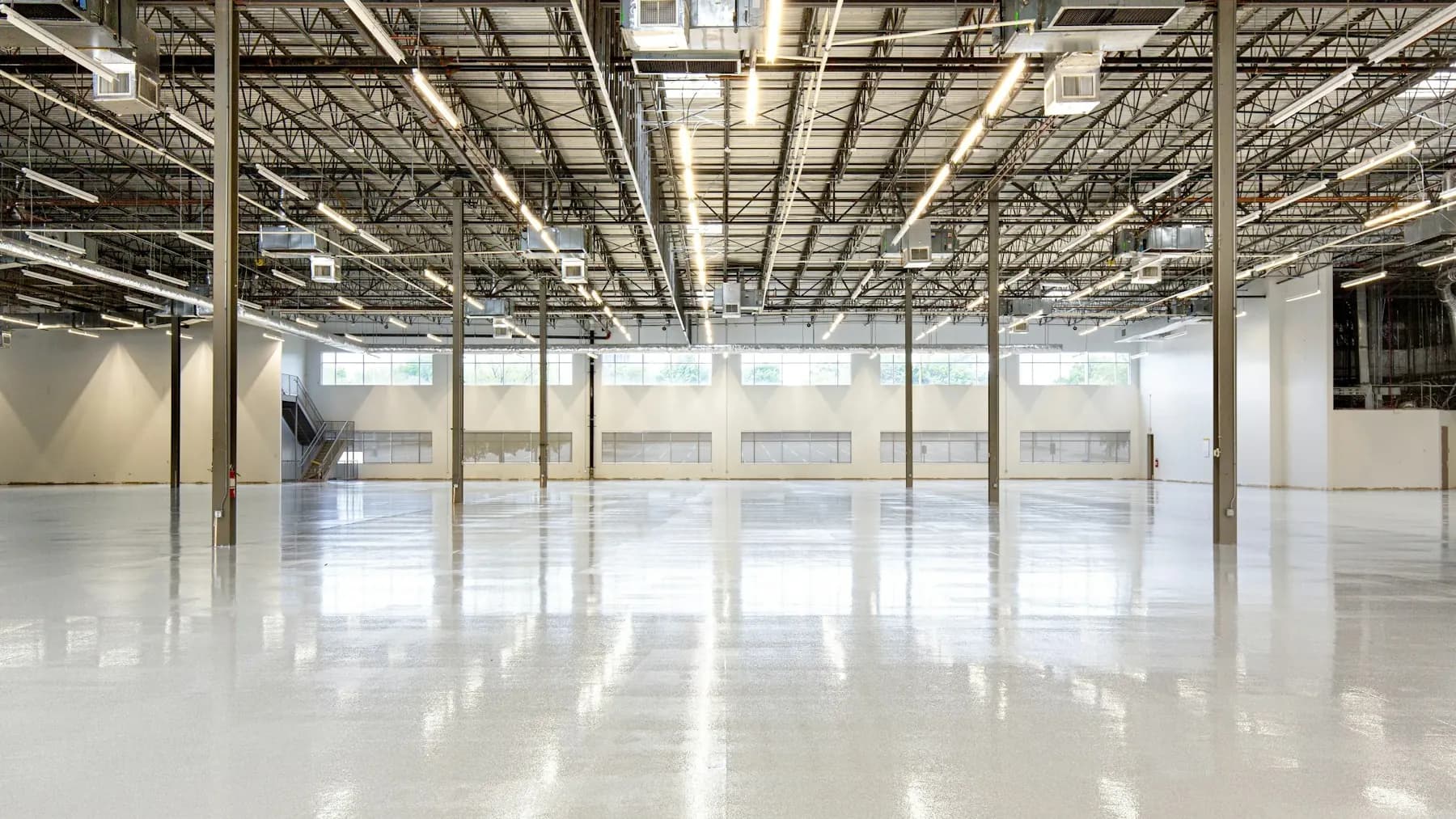 Empty interior with a large polished concrete floor