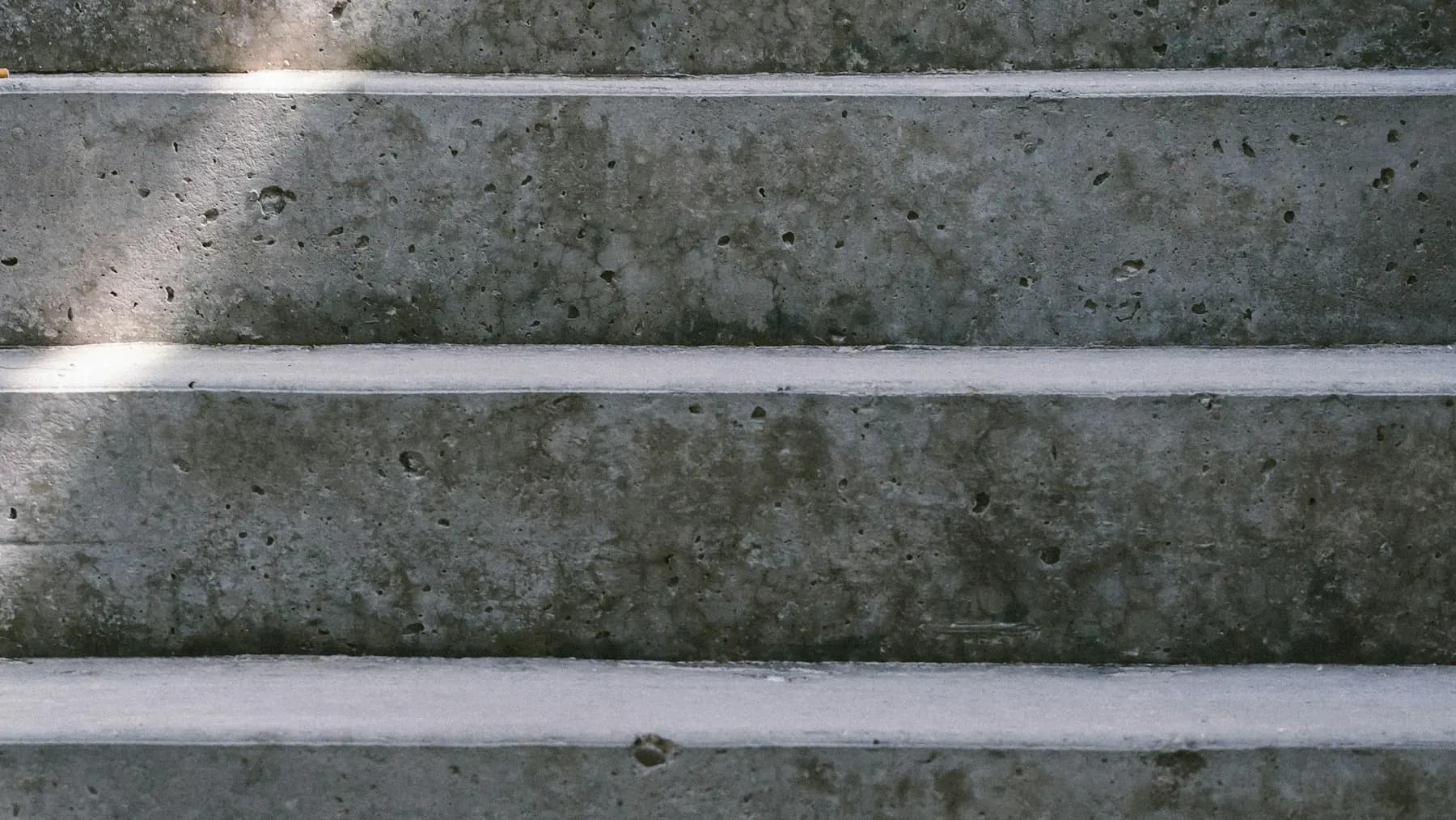 Poured concrete steps with clean, crisp edges in daylight