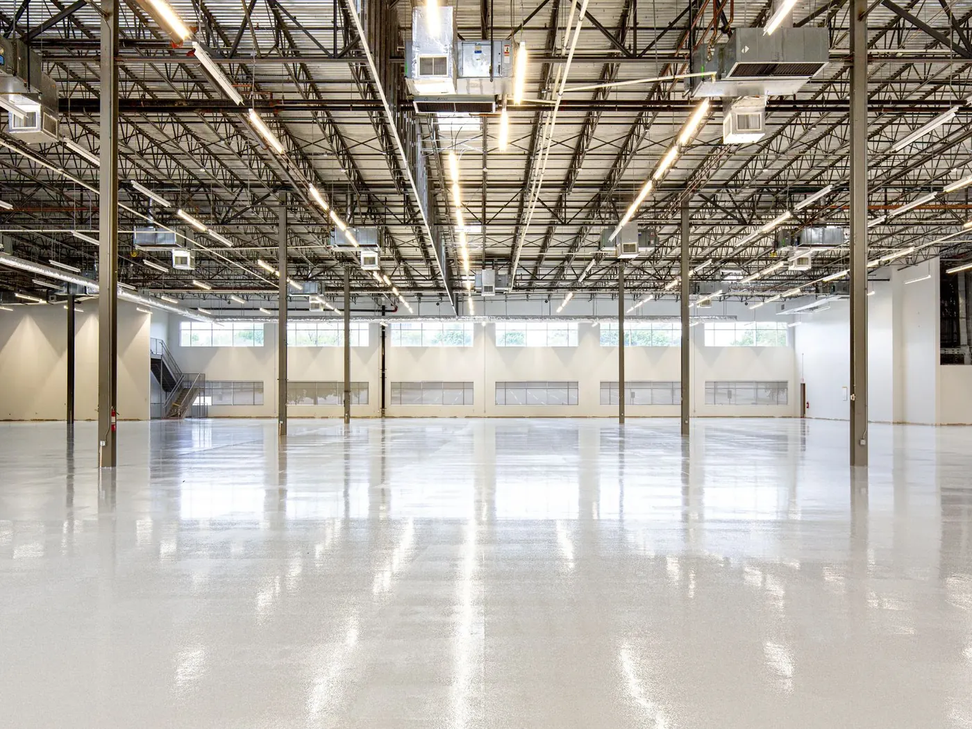 Large commercial hall with a reflective concrete floor