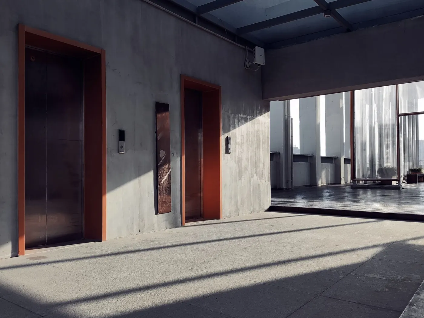Concrete floor running through an empty commercial interior