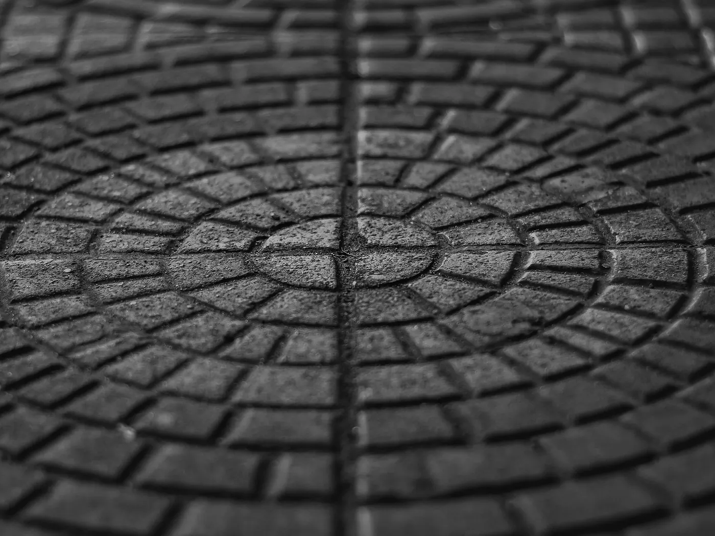 Circular fan pattern stamped into a paved surface